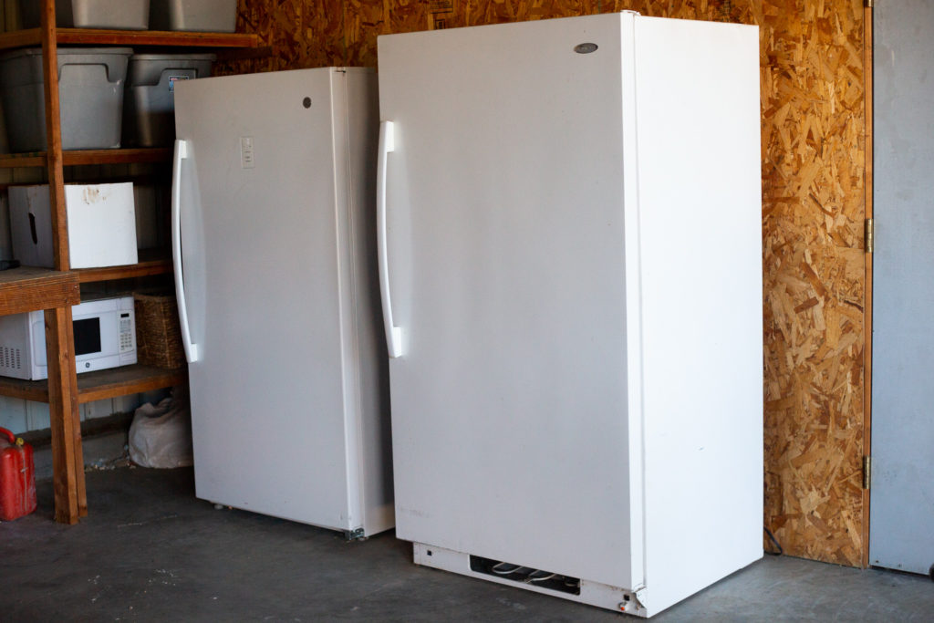 two upright freezers in garage 