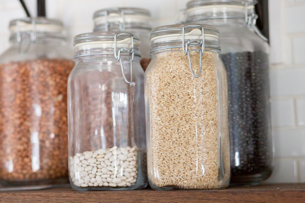 rice and beans sitting in jars 