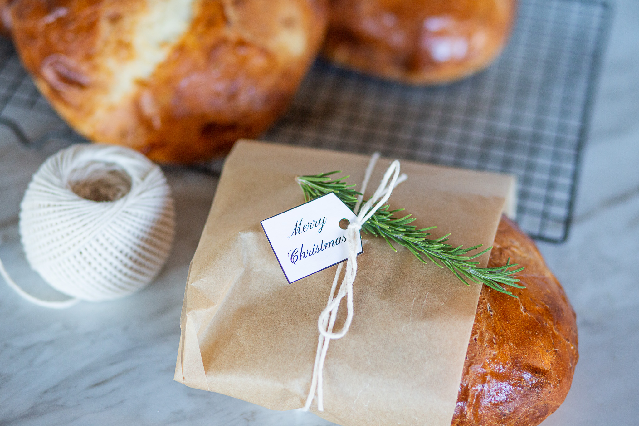 bread wrapped in parchment paper with gift tag
