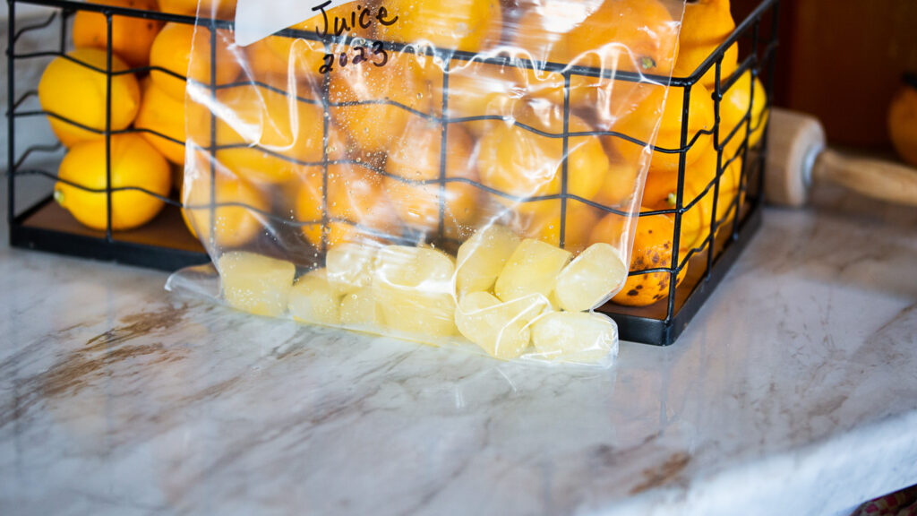 frozen lemon juice cubes in freezer bags 