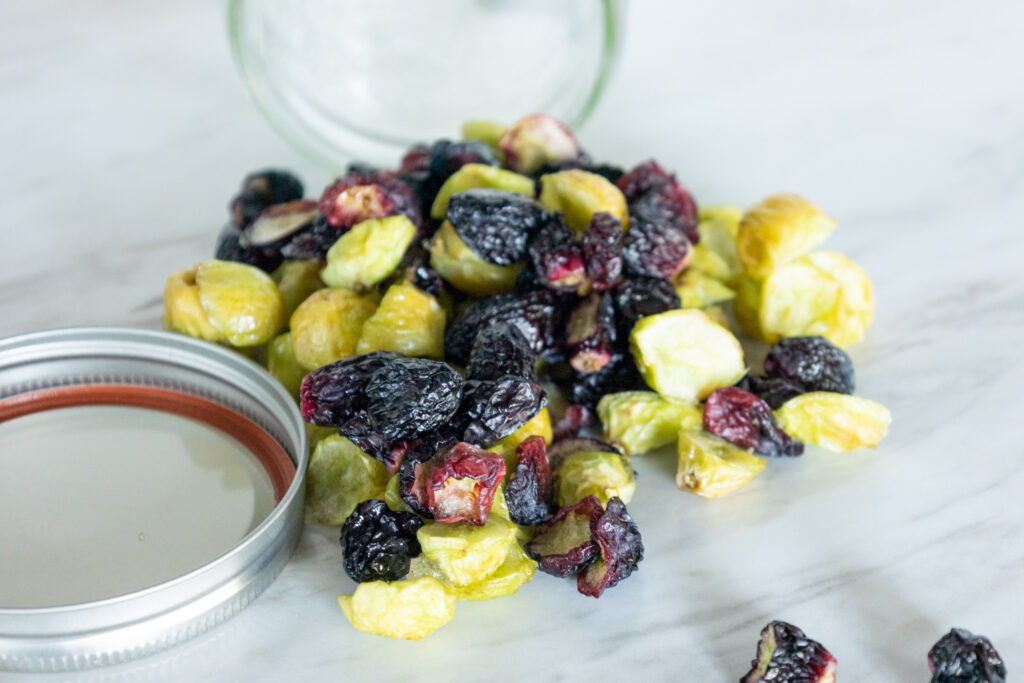 freeze dried grapes pouring out of jar