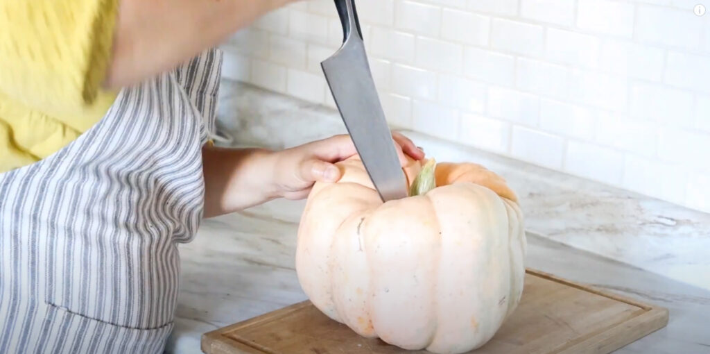 cutting a homegrown pumpkin