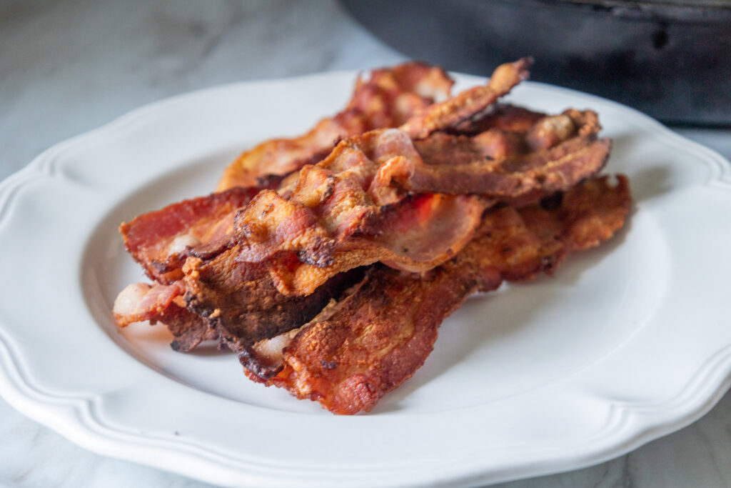 bacon sitting on plate 